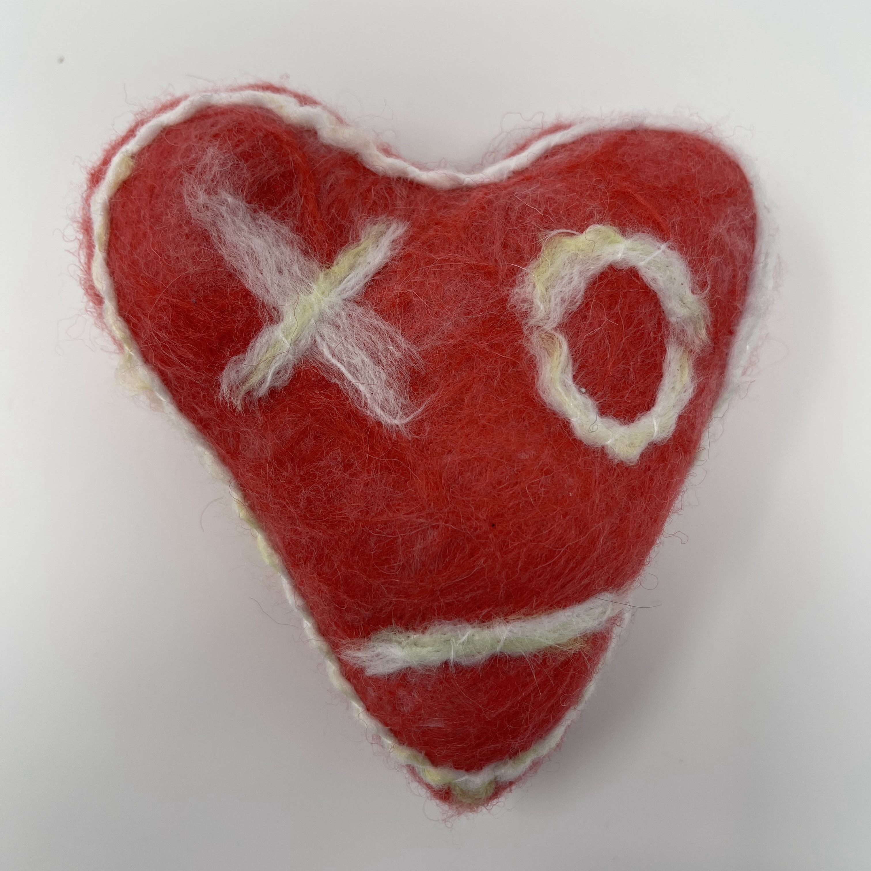 #1 Stuffed red and white felted heart with X and O design and white border. 6x6x2.5"