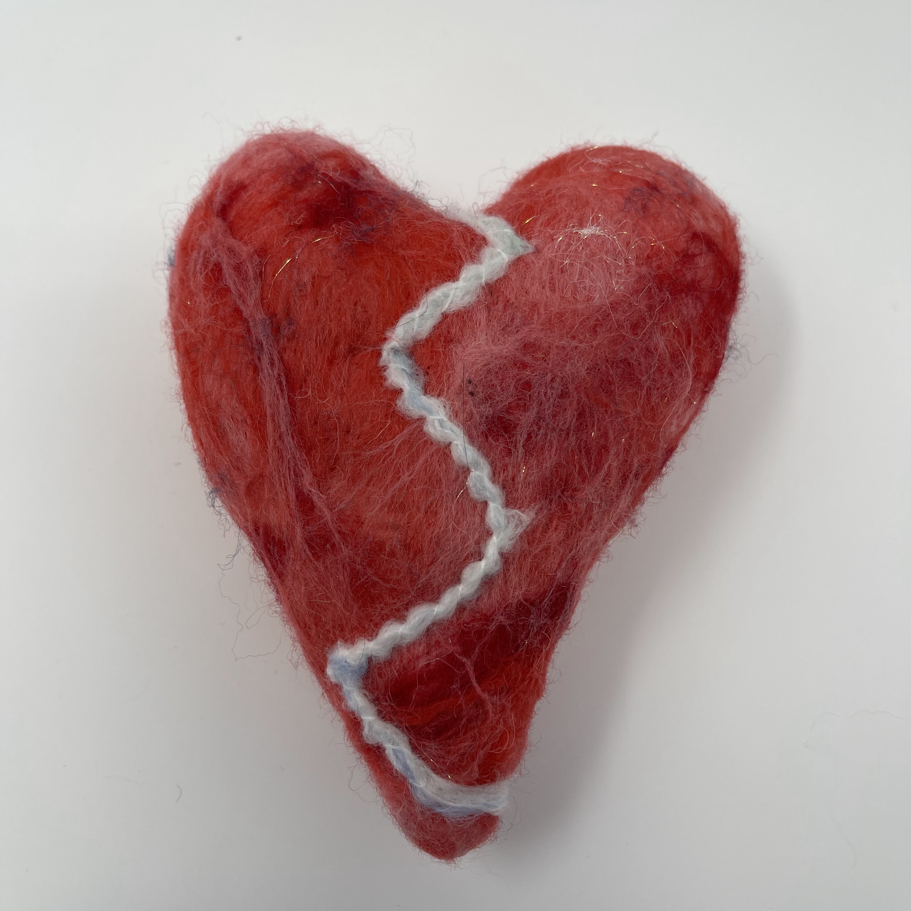 #17 Stuffed red and pink felted heart with vertical white zig-zag design. 7.5x5.5x2"