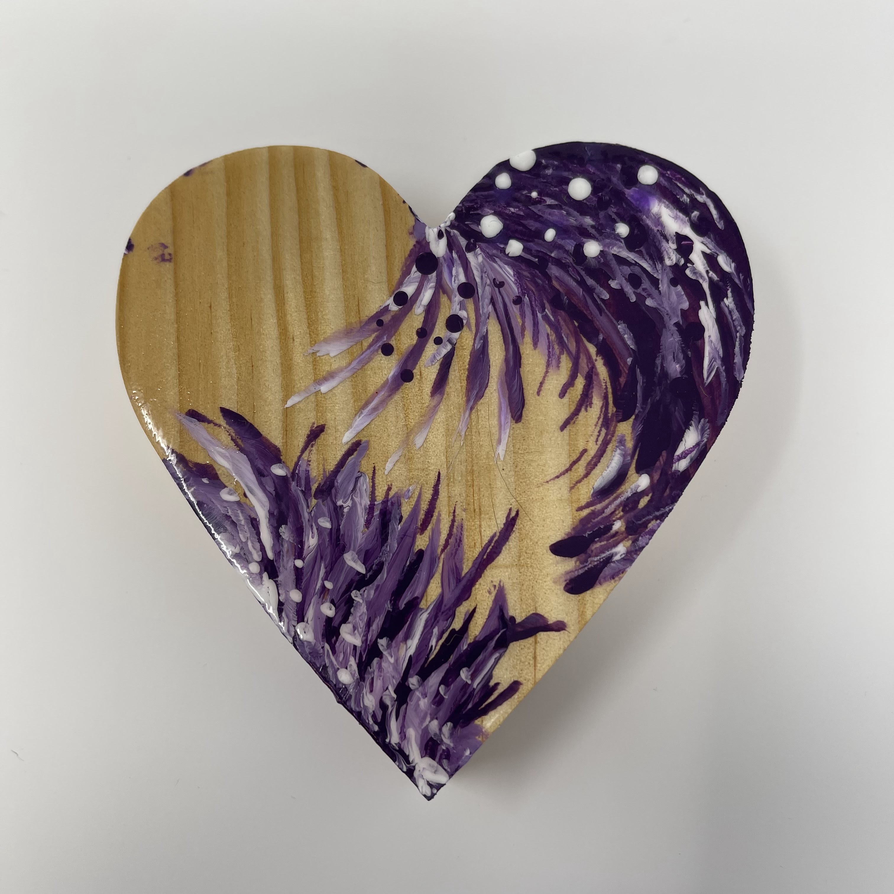 #2 Wood heart with feather like designs in white and purples. 4x4x1"