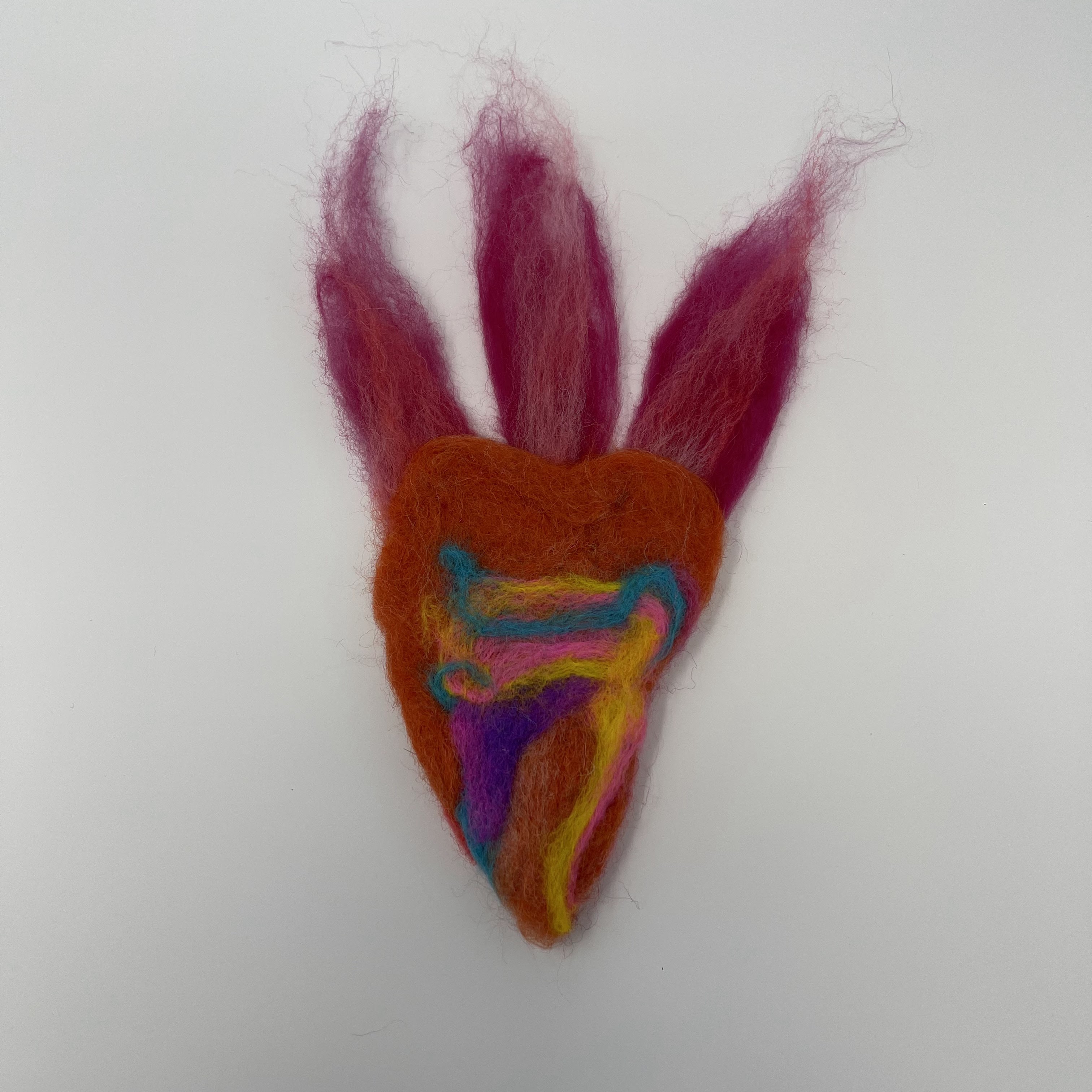 #4 Red felted heart with pink, blue, yellow, and purple swirl design. Three pink flames on top of heart. 9x5"