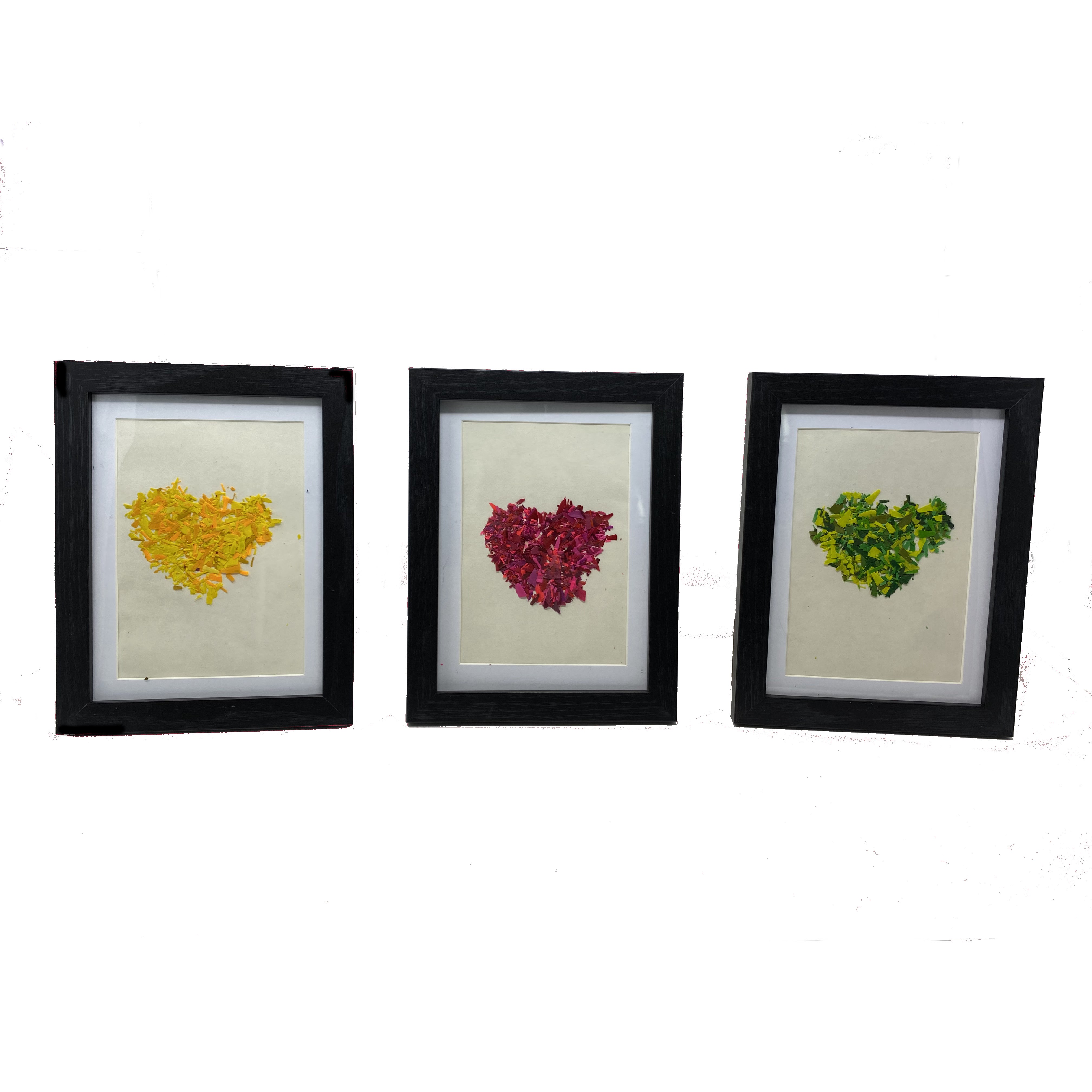 #40 Set of three framed red, yellow, and green hearts made with melted crayon shavings