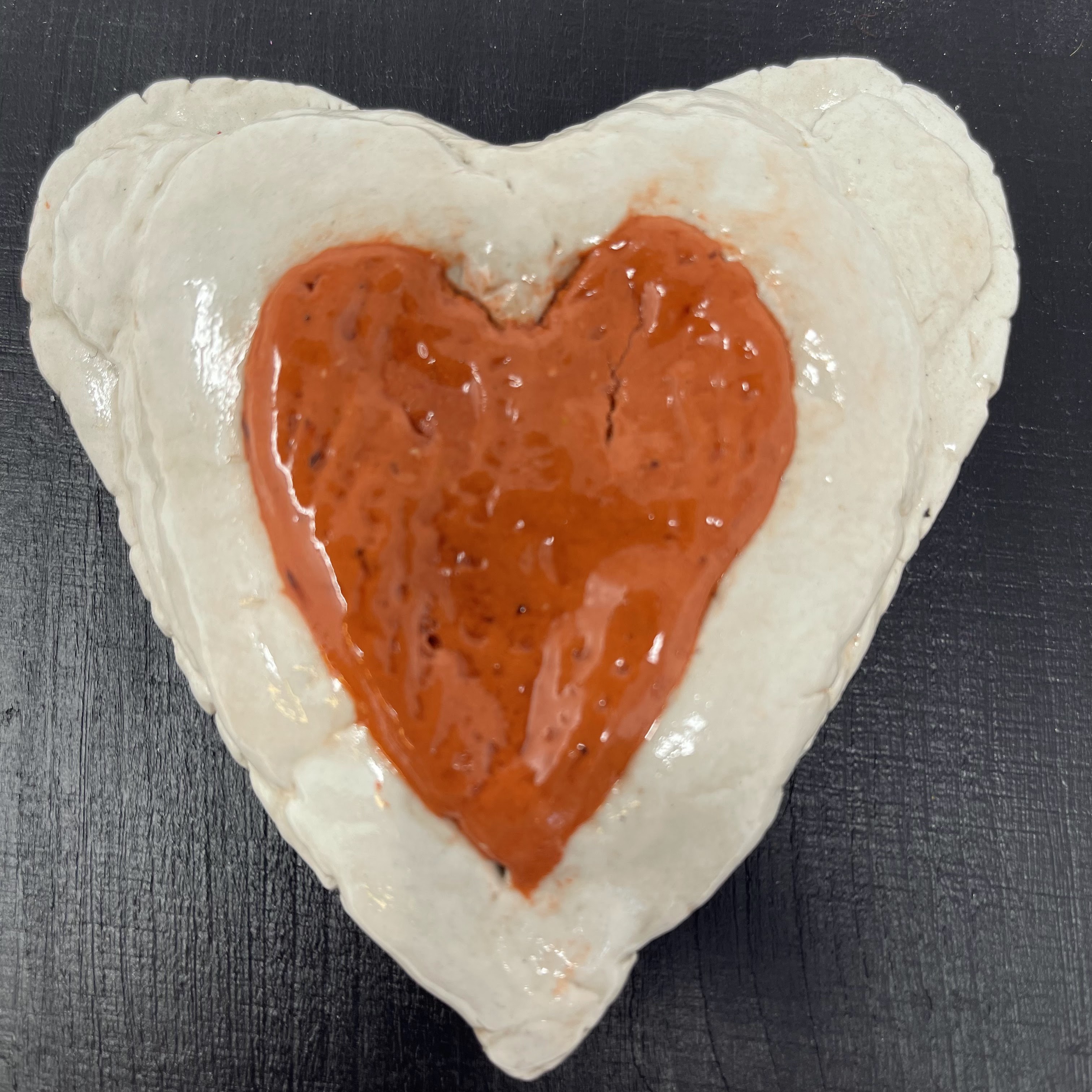 #50 White and red clay heart on square black wood block.5x5x2"