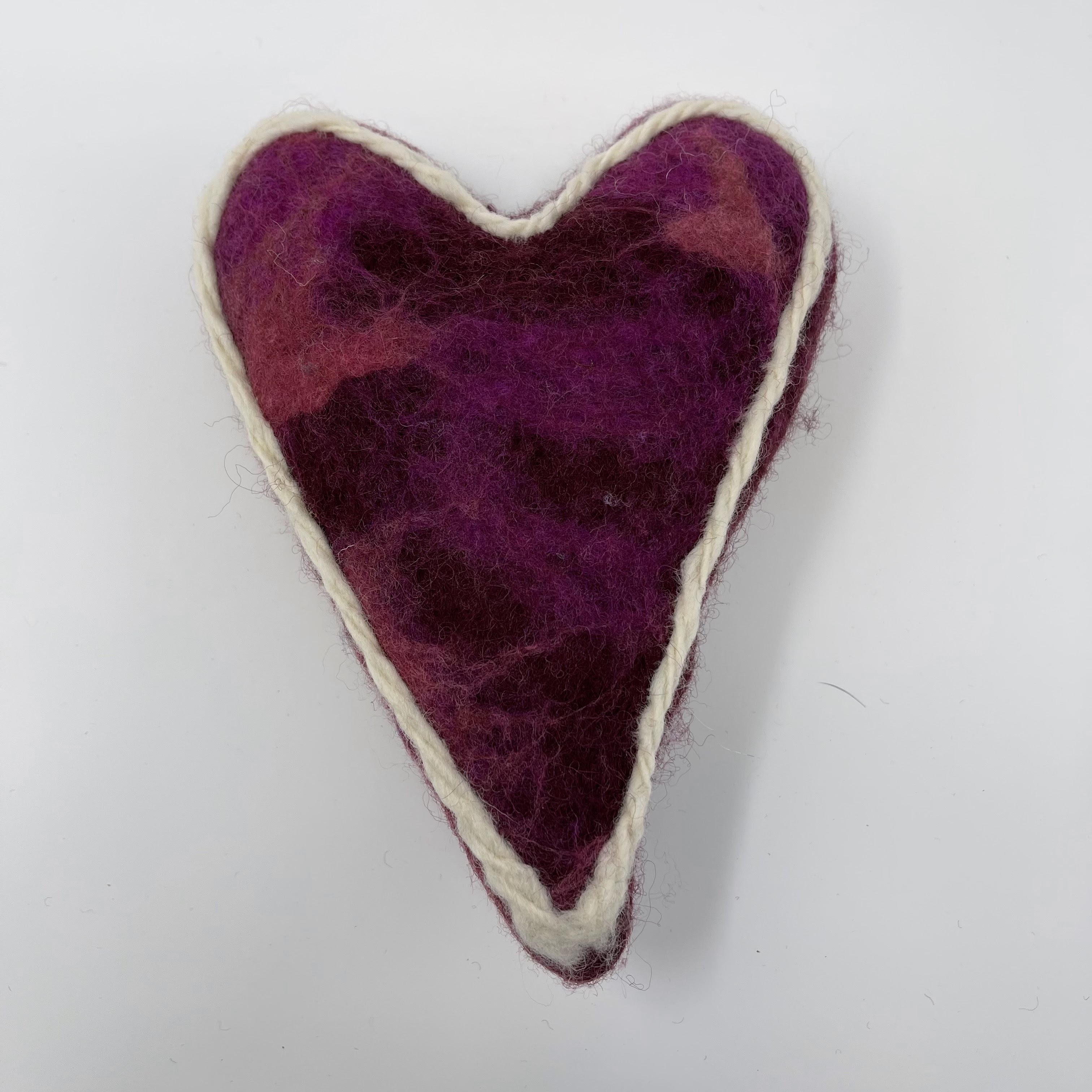 #58 Stuffed felted heart. Red with white crocheted outline. 8x6x3"