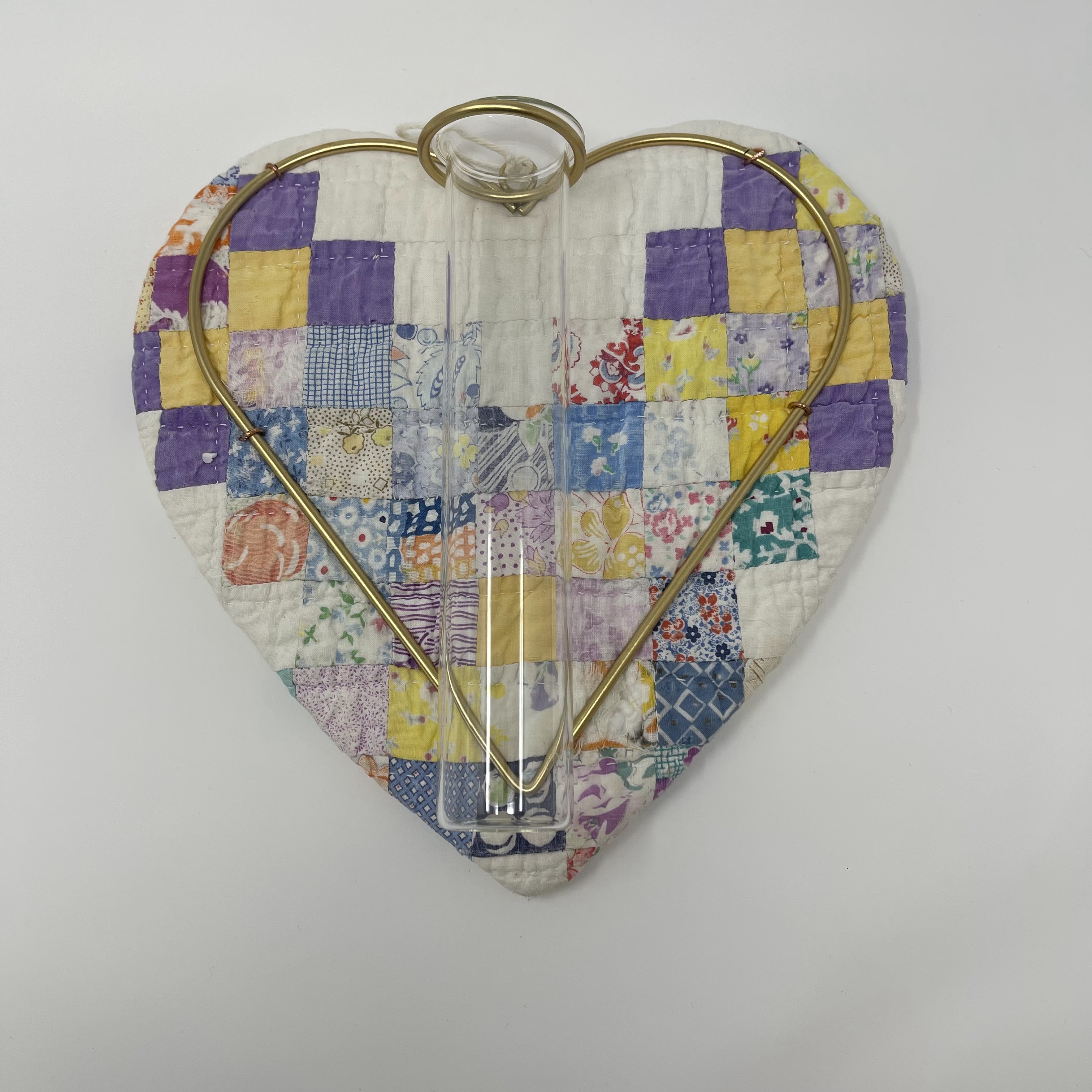 #69 Heart shaped wall vase made from antique quilt, purple, yellow, and white