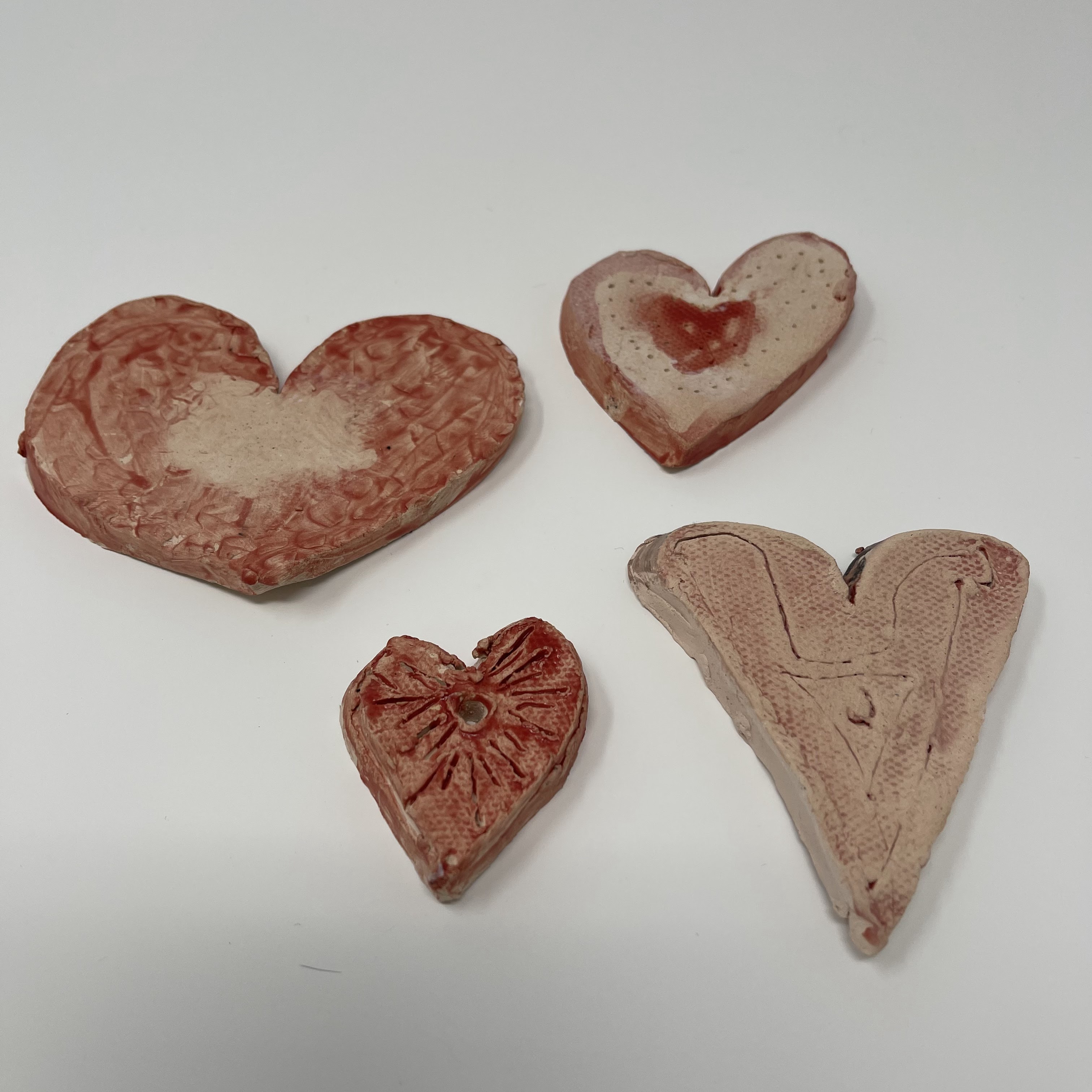 #77 Set of four textured ceramic hearts