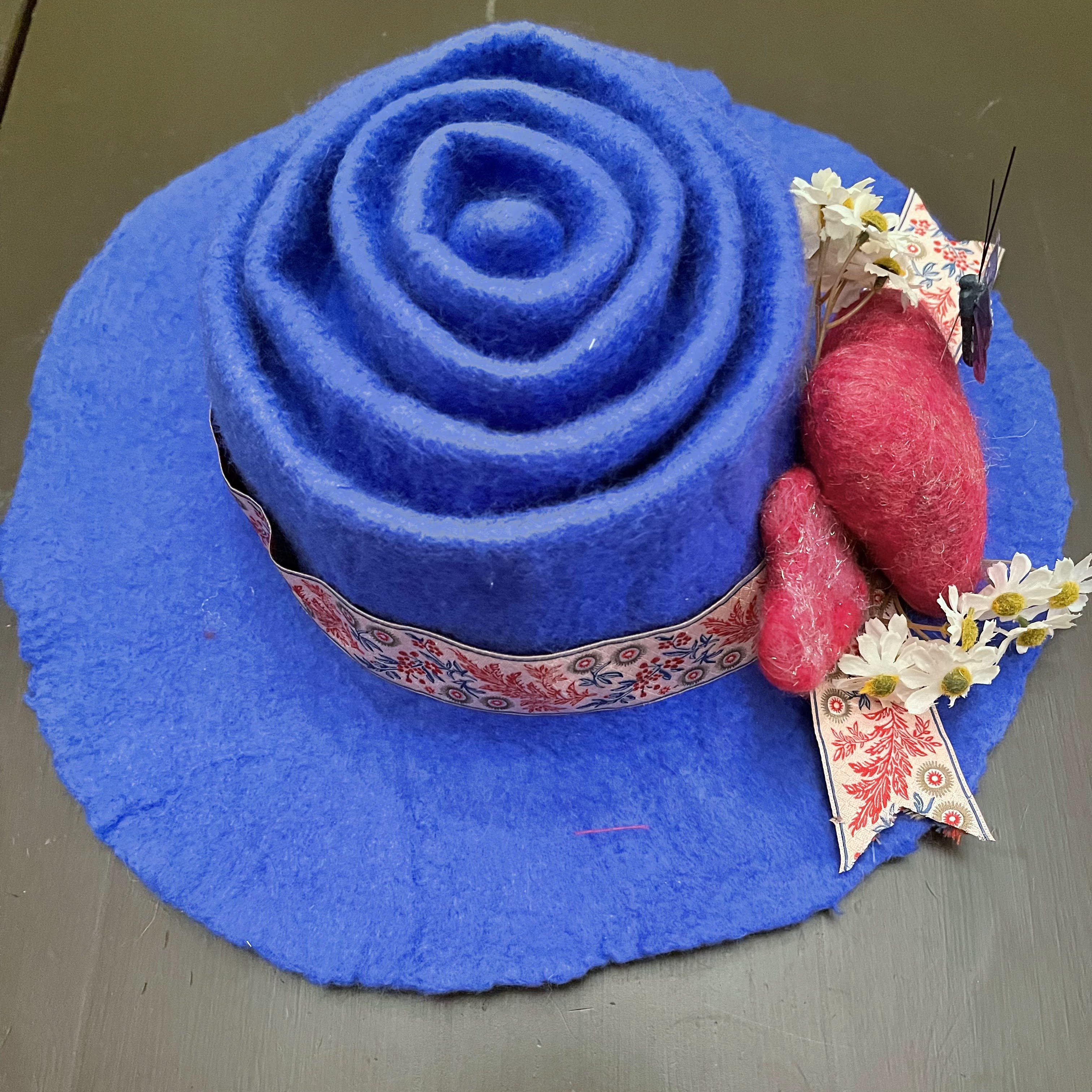 #80 Hand felted blue concertina tea hat with vintage floral ribbon, hand felted hearts, and embellishments